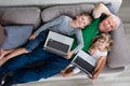 Family With Their Laptop And Digital Tablet At Home Royalty Free Stock Photo