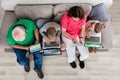 Family With Their Laptop And Digital Tablet At Home Royalty Free Stock Photo