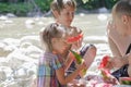 Family of three beach picnic with watermelon Royalty Free Stock Photo