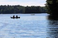 Family of Three Canoeing on the Lake Royalty Free Stock Photo