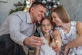 Family of Three Celebrating Christmas at Home Royalty Free Stock Photo