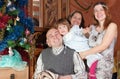 Family of three generations with Christmas tree Royalty Free Stock Photo