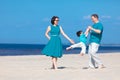 Family of three having fun on beach Royalty Free Stock Photo