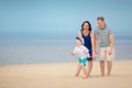 Family of three having fun on tropical beach Royalty Free Stock Photo