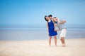 Family of three having fun on tropical beach Royalty Free Stock Photo