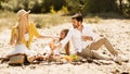 Family Of Three Having Picnic Enjoying Sunny Day In Nature Royalty Free Stock Photo