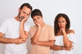 Family of three, mother, father and son standing over white isolated background thinking looking tired and bored with depression Royalty Free Stock Photo