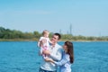 The family of three people has a rest outdoors Royalty Free Stock Photo