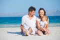 Family of three on tropical beach Royalty Free Stock Photo