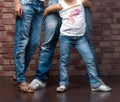 Family of three wearing blue jeans Royalty Free Stock Photo