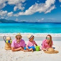 Family with three year old boy on beach. Seychelles, Mahe Royalty Free Stock Photo