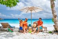 Family with three year old boy on beach. Seychelles, Mahe Royalty Free Stock Photo