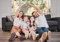 Family ties. a young family happily bonding together on the lounge floor at home.