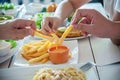 Family time eat French fries together Royalty Free Stock Photo