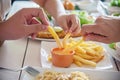 Family time eat French fries together Royalty Free Stock Photo