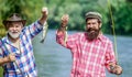 Family time. Fisherman with fishing rod. Activity and hobby. Mature man with friend fishing. Summer vacation. Happy Royalty Free Stock Photo