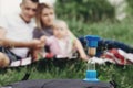 Family time.Hourglass at family blurred background