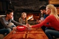 Family time- parents and children playing cards at home Royalty Free Stock Photo