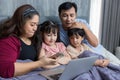Family time together at home. Happy Family. Happy family and digital technology. family parents and son lying on the bed using sma Royalty Free Stock Photo