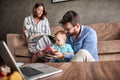 Family time- father reading book for little baby son at home Royalty Free Stock Photo