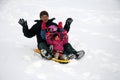 Family tobogganing Royalty Free Stock Photo