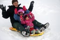 Family tobogganing Royalty Free Stock Photo