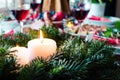 Family together Christmas celebration concept. Festive place setting for holiday dinner with natural decorations from fir tree Royalty Free Stock Photo