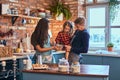 Family together cooking breakfast in loft style kitchen. Royalty Free Stock Photo