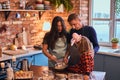 Family together cooking breakfast in loft style kitchen. Royalty Free Stock Photo