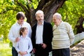 Family together. Grandfather, father and kids