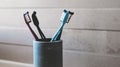 Family Toothbrushes In Bath Cup In Bathroom Royalty Free Stock Photo