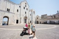 Family of tourists against Basilica of Saint Nicholas in Bari, catholic church, Puglia, South Italy Royalty Free Stock Photo