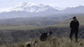 Family of tourists on a journey admire the view of the mountains. Creative. Hikers on a mountain top.