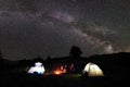 Family hikers having a rest at night camping in mountains Royalty Free Stock Photo