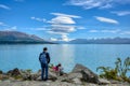 Family tourists Mother is looking at two children enjoying the beautiful and great nature at Pukaki Lake