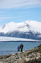 Family tourists, snow-capped mountain, Jokulsarlon Lagoon, Icel