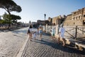 Family tourists walking in street Via dei Fori Imperiali in Rome, Italy Royalty Free Stock Photo