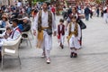 A family walking in the square during the spring festival of Bando de la Huerta. Murcia, Spain, on April 23, 2019