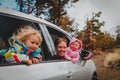 Family car travel - happy mother with kids driving in mountains Royalty Free Stock Photo