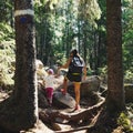 Family travel. Hiking in the woods. Mother and daughter