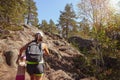 Family travel. Strong mother helps her daughter climbing