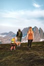 Family travelers hiking in mountains parents and child climbing together healthy lifestyle active adventure vacations Royalty Free Stock Photo
