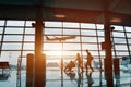 Family traveling with children, silhouette in airport