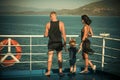 Family travelling on cruise ship on sunny day. Family with cute son on summer vacation. Father, mother and child stand Royalty Free Stock Photo