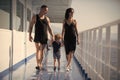 Family travelling on cruise ship on sunny day. Family rest concept. Father, mother and child walk on deck of cruise Royalty Free Stock Photo