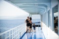 Family travelling on cruise ship on sunny day Family and love concept. Father, mother and child stand on deck of cruise Royalty Free Stock Photo