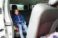 Family travelling in minivan to airport
