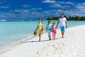 Family on a tropical beach vacation Royalty Free Stock Photo