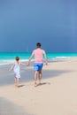 Family at tropical beach walking together in caribbean island Royalty Free Stock Photo