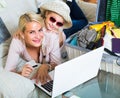 Family of two buying tickets online Royalty Free Stock Photo